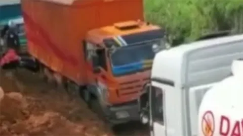 BeiBen Heavy-Duty Truck Driving on Muddy Road